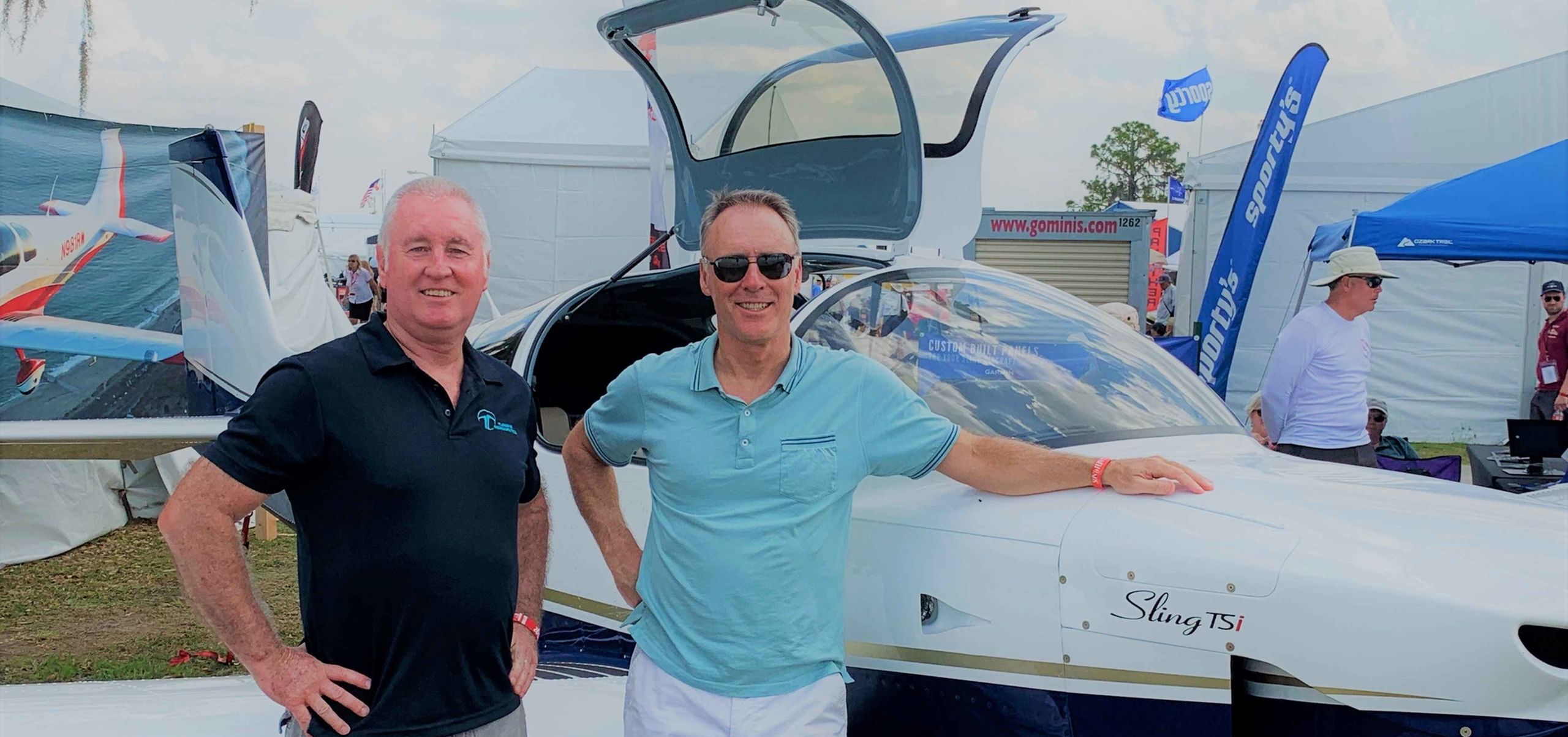 Dave and Andrew standing in front of aircraft Sun 'n Fun 2019